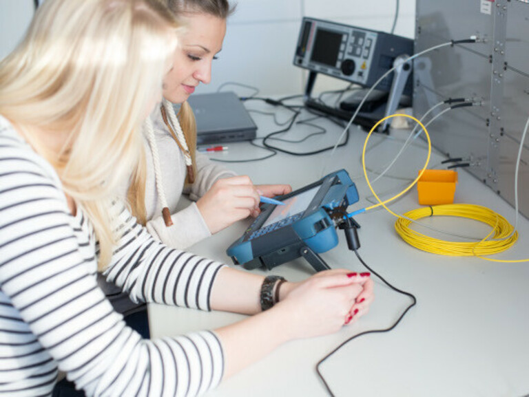 Students working with a measuring device