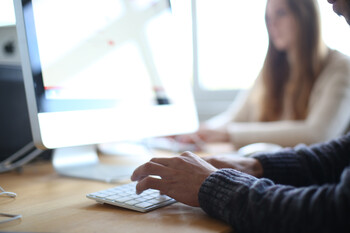 Two Mac workstations at which students work