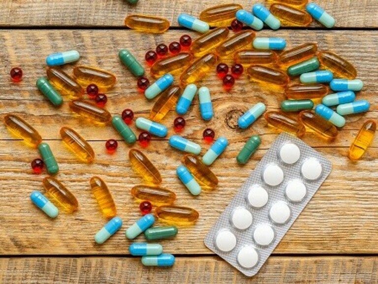 medical pills and pack tablet  on wodden table